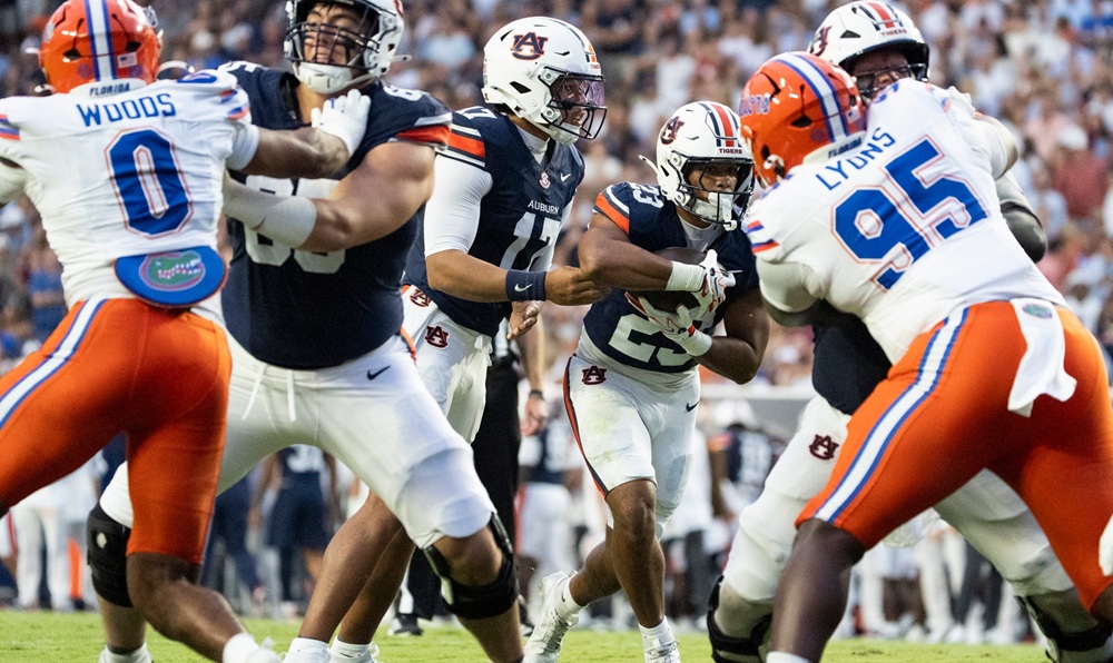 Auburn Tigers quarterback Byrum Brown (17) hands the ball off to running back Jeremiah Cobb (23) as Auburn Tigers take on
